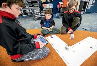  ?? DAVID UNWIN/STUFF ?? Whakarongo School pupils Daniel Butts, left, Marcel Rivera and Callum Swindells work together on a Sphero Lyft Challenge.