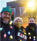  ??  ?? ■ The Cortes family, above, is dressed so colorfully they seem ready to join in Atlanta’s parade Saturday night. From left, they are, Carlos, Arianna and Claudia Cortes.