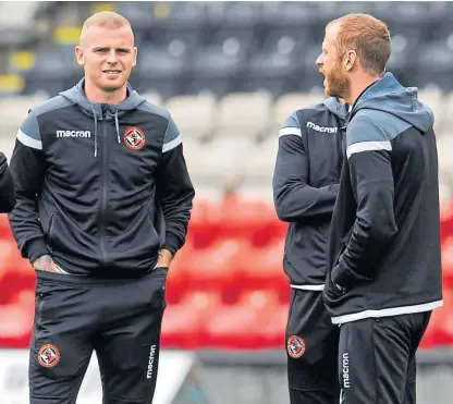  ?? Picture: SNS Group. ?? Dundee United’s centre-half duo of Mark Connolly and Mark Reynolds had a couple of wobbly moments against Partick Thistle but are adapting to their new style.