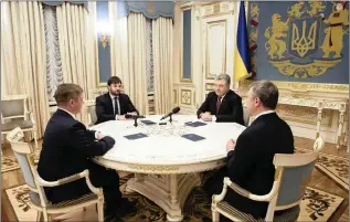  ??  ?? Ukrainian President Petro Poroshenko,second right, attends a meeting with chiefs of Ukrainian energy firm Naftogaz, including its chief executive Andriy Kobolyev, left) after a Stockholm court ruled in Naftogaz’s favour in a dispute with Russia’s...