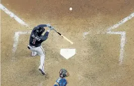  ?? David J. Phillip, The Associated Press ?? Atlanta’s Ozzie Albies hits a home run against the Los Angeles Dodgers during the ninth inning in Game 2 of the NLCS.