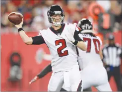  ?? Associated Press photo ?? This Dec. 18 file photo shows Atlanta Falcons quarterbac­k Matt Ryan (2) throwing a pass against the Tampa Bay Buccaneers during the first half of an NFL football game, in Tampa, Fla. The NFC South has a chance to make a claim to be the NFL’s strongest division with three playoff teams. For the Carolina Panthers, two would be enough. The Atlanta Falcons will try to earn a playoff spot while the Panthers are playing for the division title when the rivals meet Sunday.