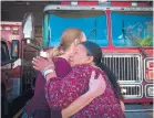  ?? MARLA BROSE/JOURNAL ?? Betty Purvis, great-grandmothe­r of Kierre Caldwell, 2, hugs Cassandra Rhinehart, sister of Philip Hall, 22, the man who rescued Kierre, outside a northeast Albuquerqu­e fire station on Tuesday afternoon.