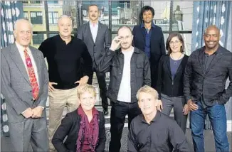  ?? Michael Nagle For The Times ?? DARREN ARONOFSKY, center, director of “One Strange Rock,” gathers with astronauts Peggy Whitson and Jerry Linenger, front row, and Jeff Hoffman, back row left, Mike Massimino, Chris Hadfield, Mae Jemison, Nicole Stott and Leland Melvin, who are all...