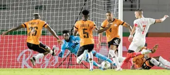  ?? — AFP photo ?? Morocco’s Hakim Ziyech (right) kicks to score during the match against Zambia.