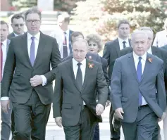  ??  ?? Putin (centre),Vucic and Netanyahu (right) arrive to watch the Victory Day parade, marking the 73rd anniversar­y of the victory over Nazi Germany in World War Two, at Red Square in Moscow. — Reuters photo