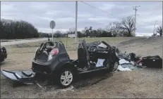  ?? KFOR VIA AP NEWSNATION ?? In this image provided by KFOR-TV, a heavily damaged vehicle is seen off a road in Tishomingo, Okla., following a two-vehicle collision in which six teenage students were killed, on Tuesday.