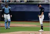  ?? AP PHOTO BY JAE C. HONG ?? Tampa Bay Rays pitcher Shane Mcclanahan, right, waits to be relieved during the seventh inning in Game 6 of a baseball American League Championsh­ip Series against the Houston Astros, Friday, Oct. 16, in San Diego.