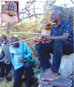  ??  ?? Spirit medium Bvumavaran­da uses ephod to identify the location of the gourd. Inset: Part of the clay gourd exhumed
