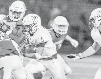  ?? Juan DeLeon ?? Deer Park running back Angel Vargas (5) searches for daylight against LaPorte in the first half. At one point, Vargas carried the ball on 15 consecutiv­e plays.