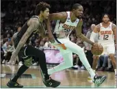  ?? CHRIS CARLSON — THE ASSOCIATED PRESS ?? Phoenix forward Kevin Durant, driving to the basket Wednesday, scored 23 points in his debut with the Suns.