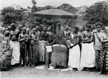  ??  ?? Regalia restored Oba Eweka II, pictured c1920 surrounded by his subjects. Having succeeded Oba Ovonramwen in 1914, Eweka was presented with the royal coral regalia that had been seized by the British in 1897