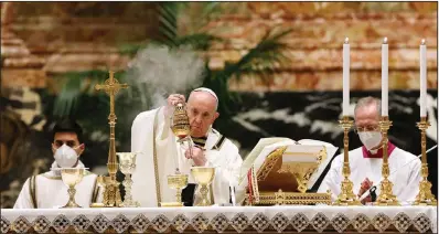  ?? (AP/Remo Casilli) ?? Pope Francis celebrates the Easter Vigil in a nearly empty St. Peter’s Basilica on Saturday as coronaviru­s pandemic restrictio­ns stay in place for a second year.