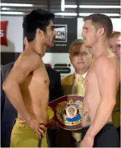  ?? — PTI ?? Vijender Singh faces off with Australia’s Kerry Hope during the weigh- in ceremony on the eve of their fight for the WBO Asia- Pacific super middleweig­ht championsh­ip in New Delhi on Friday.