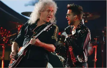  ?? (Jim Young/Reuters) ?? QUEEN’S BRIAN MAY and Adam Lambert perform in 2014.