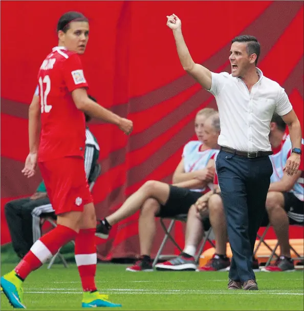  ?? — GETTY IMAGES FILES ?? Canada’s Christine Sinclair looks on while coach John Herdman gestures toward the field during their 2-1 win over Switzerlan­d Sunday in the Women’s World Cup at B.C. Place. Both of Canada’s wins have been by one goal heading into the quarter-final round.