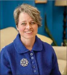  ?? NATHAN BURTON/Taos News ?? Lisa O’Brien sits for a portrait Friday (Feb. 10) at the Taos Community Foundation. After six years as the foundation director, O’Brien is stepping down.