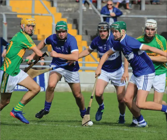  ??  ?? “All eyes on the ball” as Lixnaw’s Brian McAulliffe and St Brendans Kevin Orpen and Rory Horgan all aim for possession as Lixnaws Ricky Heffernan watches the action unfold during the Lixnaw v St Brendans semi final of the Garvey Supervalu Senior...