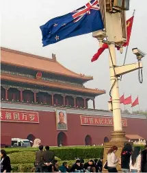  ??  ?? The New Zealand flag flies in Beijing in more optimistic times in 2008.