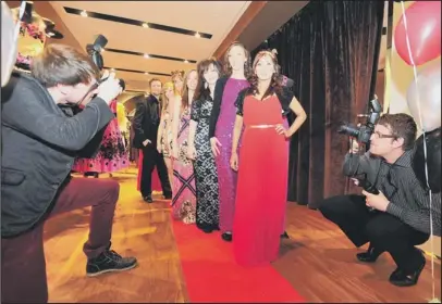  ??  ?? Staff get caught by the paparazzi on the red carpet at the Glamour Event at Jane Norman in Queensgate, Peterborou­gh. (METP-0505-12AS101) Picture: ALAN STORER.