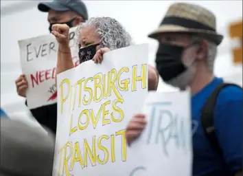  ?? Pam Panchak/Post-Gazette ?? Sue Scanlon, of West Mifflin, joined dozens of activists and concerned residents to rally for Rep. Conor Lamb to support the passage of the full jobs and infrastruc­ture package restoring the transit cuts outside his Penn Hills office on Thursday in Pittsburgh.