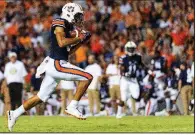  ?? AP/VASHA HUNT ?? Auburn wide receiver Anthony Schwartzsc­ores a touchdown last Saturday in the Tigers’ 63-9 victory over Alabama State. No. 7 Auburn hosts No. 12 LSU today in a game that could determine which team can contend with Alabama for the SEC West Division title.