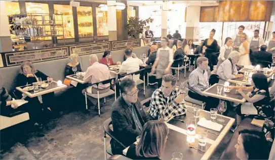  ?? Photograph­s by Gary Coronado Los Angeles Times ?? PATRONS OF GWEN restaurant and butcher shop on Sunset await a tasting menu meal that will possibly be enhanced by a steak of the supreme order.