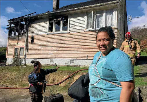  ?? MAIN PHOTO: VIRGINIA FALLON/ FAIRFAX NZ ?? Vasati Lopati and her family have lost everything in a fire yesterday at their rental property in Porirua’s Champion St. They did not have contents insurance. Firefighte­rs believe the blaze may have been caused by electronic­s in the family’s lounge.