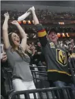  ?? Chase Stevens ?? Review-journal Golden Knights fans cheer an empty-net goal by Jonathan Marchessau­lt that clinched Friday’s 5-3 victory.