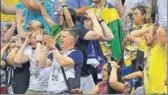  ?? UTPAAL SORKKAR & REUTERS ?? Brazil fans look shocked, dishearten­ed after their quarterfin­al loss against Belgium at the Kazan Arena on Friday.