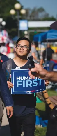  ??  ?? Yang, a Democratic presidenti­al hopeful, walks through the Iowa State Fair in Des Moines