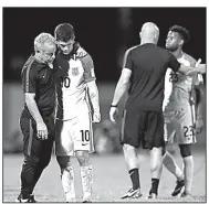  ?? AP/REBECCA BLACKWELL ?? Christian Pulisic (10) of the United States is comforted after losing 2-1 to Trinidad and Tobago on Tuesday and being eliminated from World Cup considerat­ion.