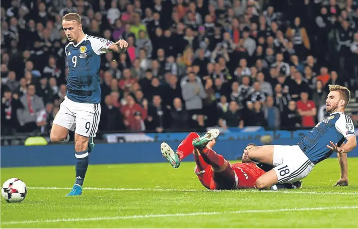  ?? Pictures: SNS Group. ?? The goals that saw off Malta at Hampden last night – left: Christophe Berra gets up above marker Samuel Magri to head the opener past keeper Andrew Hogg; above: Leigh Griffiths pounces to knock in the second after James Morrison’s effort had come back...
