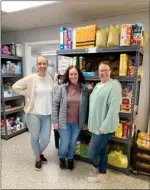  ?? PILOT NEWS GROUP PHOTO / JAMIE FLEURY ?? Racheal Filley, Aleshcha Dewitt, and Christine “Chris” Garner in the Food Pantry at the Marshall County Neighborho­od Center.