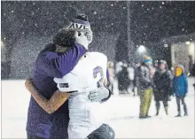  ?? JULIE JOCSAK THE ST. CATHARINES STANDARD ?? A player from the A.N. Myer Marauders is comforted after losing to St. Paul in the Niagara Bowl senior high school football championsh­ip.