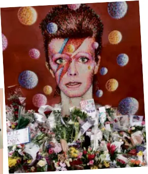  ?? AFP ?? SEND- OFF to the starman. Fans around the world memorializ­e David Bowie.