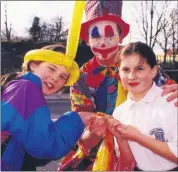  ?? ?? Helena Crowley and Lesley Maher from Ardwillin, Mitchelsto­wn being entertaine­d by a colourful friend at the official opening of the Myers Maxol Service Station in Mitchelsto­wn in March 2001.