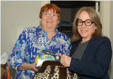  ?? MICHELLE ALLENBERG/POSTMEDIA NETWORK ?? Period Purse organizers Mary Ellen DuPon, left, and Julie Barker fill a purse will feminine hygiene products at Holy Trinity Church in Welland.