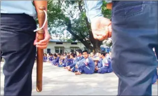  ?? HENG CHIVOAN ?? Prisoners under guard in the courtyard of Prey Sar prison in 2009. A prominent activist has called for more education programmes in Cambodia’s prisons.