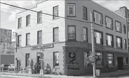  ?? CHRIS SHANNON/CAPE BRETON POST ?? The Prince Street Market at 54 Prince St. in Sydney was listed for sale on Aug. 30. Former owner Jim Matthews, a financial planner who worked in Halifax but was originally from Sydney Mines, was killed in his apartment on the third floor of the building on Aug. 29, 2017. The building was listed at $499,900 and a sale was finalized with Halifax businessma­n Dimitri Neonakis last week.