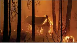  ?? NOAH BERGER — THE ASSOCIATED PRESS ?? Flames from the French Fire consume a cabin on Highway 155in Sequoia National Forest on Wednesday.