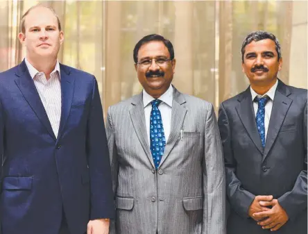  ??  ?? From left, Global Road Technology India CEO Ben James with senior executives A.K. Verma and Prashant Kalantri.