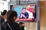  ?? — AFP ?? SEOUL: People watch a television news broadcast showing file footage of North Korean leader Kim Jong Un, at a railway station in Seoul yesterday.