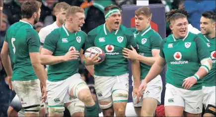  ?? PICTURE: REUTERS ?? GREEN GLEE: South African-born CJ Stander, centre, and his Ireland team-mates celebrate his try during yesterday’s Six Nations match against England at Twickenham.