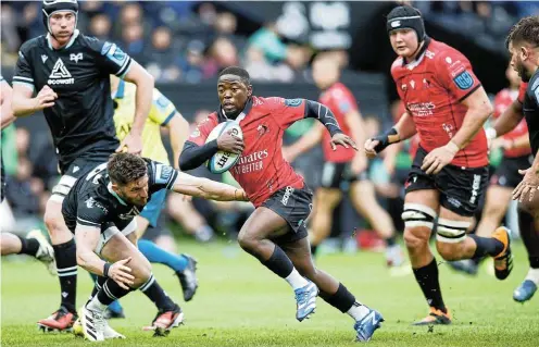  ?? Picture: Gruffydd Thomas/Huw Evans Agency ?? Sanele Nohamba of the Lions makes a break against Ospreys during the United Rugby Championsh­ip clash in Swansea last night.