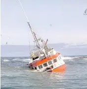  ?? COURTESY THE CANADIAN COAST GUARD ?? Top: Roger Lynn Stoddard, captain of the Fisherman’s Provider II. Above: The boat rammed up on Frying Pan Shoal, a lurking hunk of rock in the Atlantic Ocean.