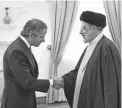  ?? IRANIAN PRESIDENCY OFFICE VIA AP ?? Iranian President Ebrahim Raisi, right, meets with IAEA Director General Rafael Mariano Grossi on Saturday.