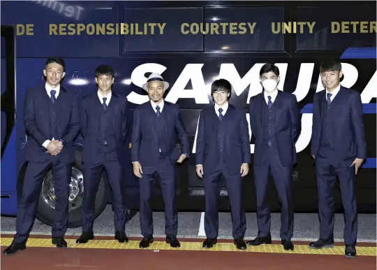  ?? The Yomiuri Shimbun ?? Members of Japan’s World Cup soccer team appear at Narita Airport before departing for Doha on the night of Nov. 9.