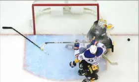  ?? Justin Berl/Getty Images ?? Edmonton’s Connor McDavid is pulled down by the Penguins’ Brian Dumoulin in front of Penguins goaltender resulting in a penalty shot Feb. 23 in the third period at PPG Paints Arena.