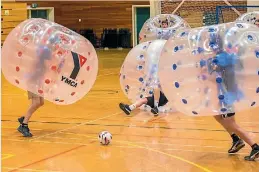  ?? PHOTO: MYTCHALL BANSGROVE/FAIRFAX NZ ?? Action from the first night of the bubble football league in Timaru.